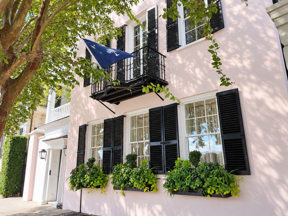 Dappled sunlight on pink Charleston facades - photo by Irina Bordyn