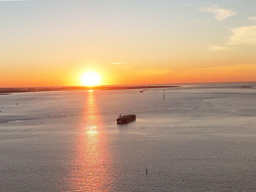 Sunrise over Charleston Harbor - photo by Irina Bordyn
