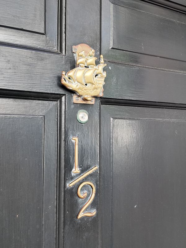 Charleston door with brass cherub knocker - photo by Irina Bordyn